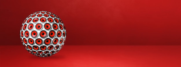 Speakers sphere isolated on a red studio banner. 3D illustration