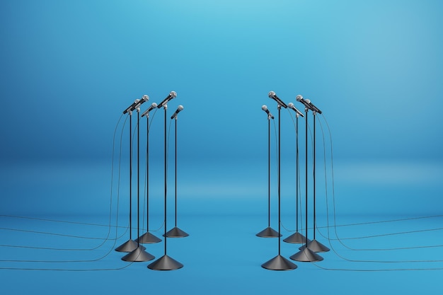 Speaking performance concept with microphones standing in a circle on blue background