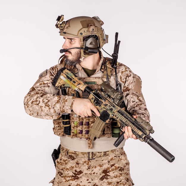 Special forces United States soldier or private military contractor holding rifle Image on a white background