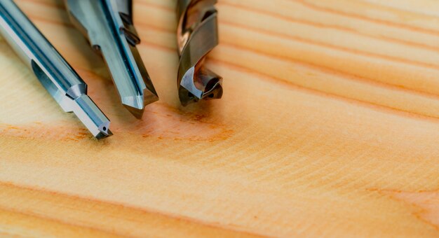 Photo special tools isolated on wooden table. made to order special tools. hss cemented carbide. carbide cutting tool for industrial applications.