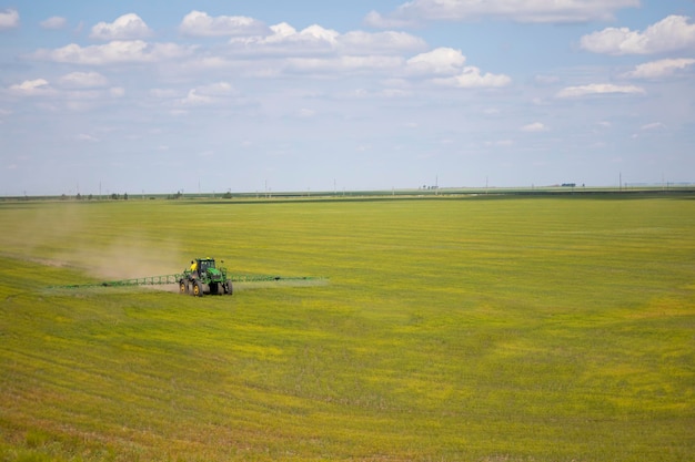 A special tractor treats the field with flax. View from the top