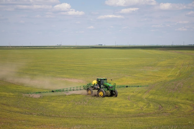 A special tractor treats the field with flax. View from the top