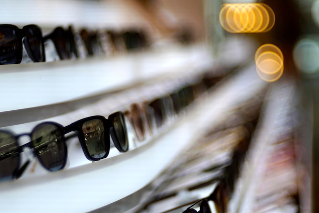 Spectacles on a white shelf with bubble blur background