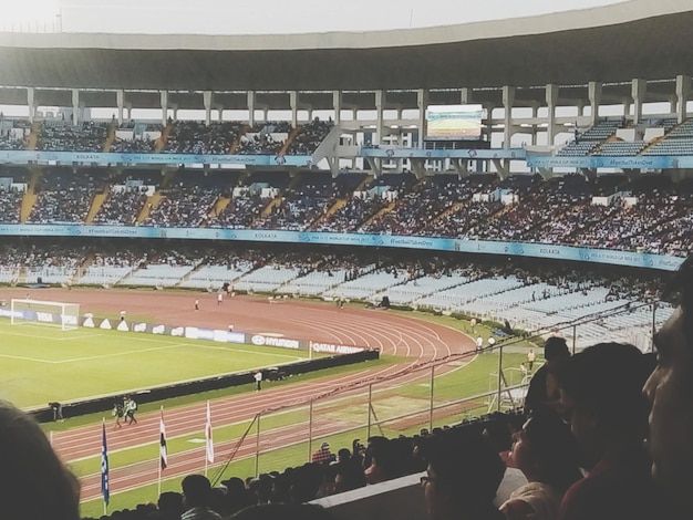 Spectator sitting in stadium