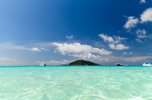 Speed boat on clear sea with white cloudy and blue sky at Similan Island phangnga Thailand