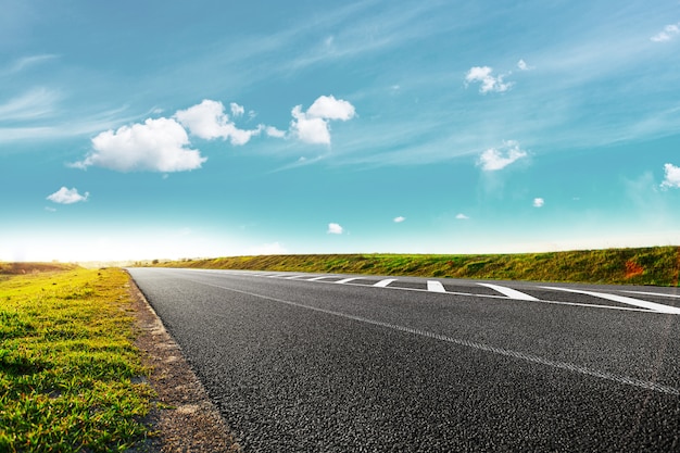 Speed highway through the field. asphalt-paved road