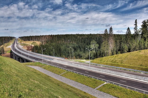 Speedway in the Leningrad region, new  Priozersk highway, drainage ditches for storm water before the bridge over the river Smorodinka.