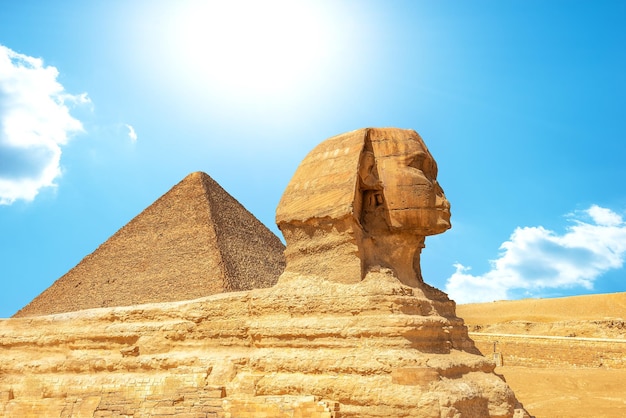 Sphinx and pyramid in Giza at sunny day, Egypt