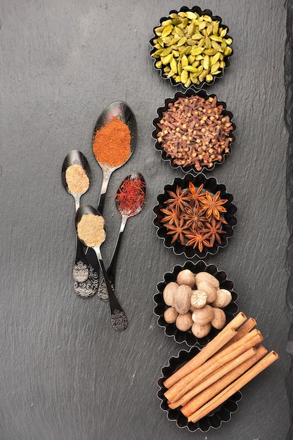 Spices for baking Spicy on the stone black background