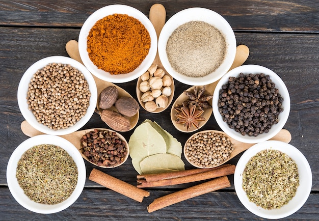 Spices and herbs in  bowls.