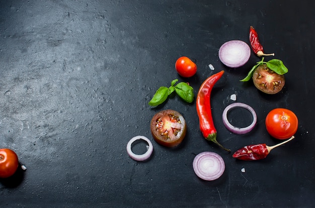 Spices and herbs for cooking dinner - ,slised tomato, onion, salt, pepper, garlic. 