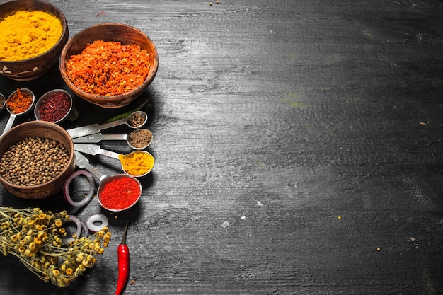 Spices and herbs with measuring spoons. 