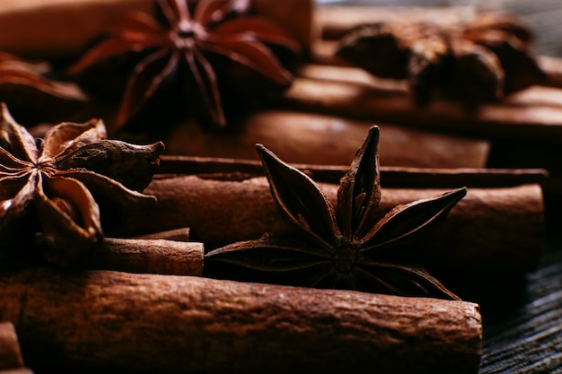 Spices sticks cinnamon and star anise on the old table