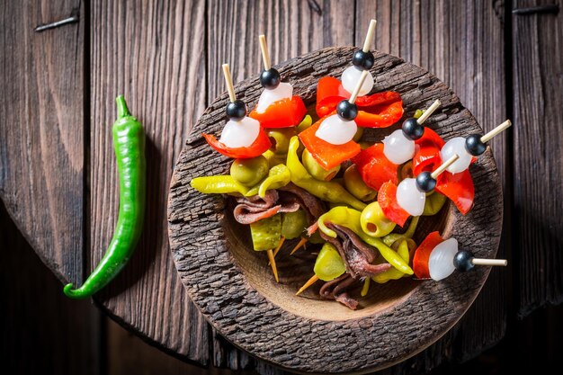 Spicy banderillas with peppers olives and anchovies for spanish corrida