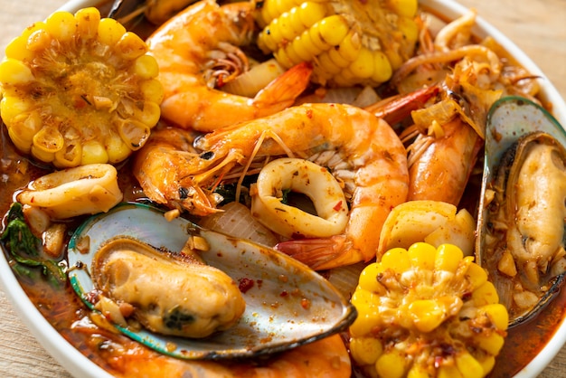 spicy barbecue seafood - shrimps, sqiud, mussel and corn