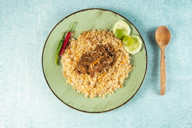 Spicy beef pulao polao biryani mandi kacchi with egg and salad served in dish isolated on table top view of indian food