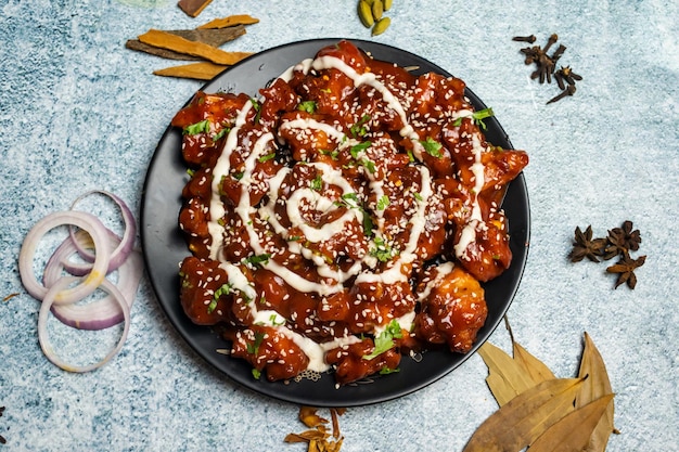 Spicy chicken Maharaja or chicken Moharaza served in a dish isolated on grey background top view of bangladesh food