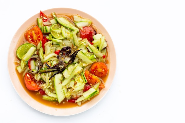 Spicy cucumber salad in plate Copy space