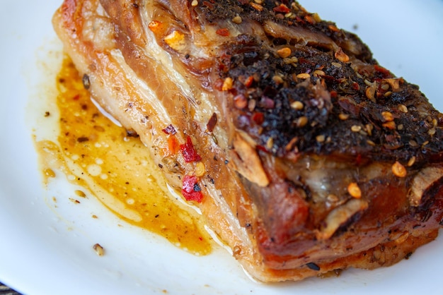 Spicy fried brisket with interlayers of pork lard baked with paprika