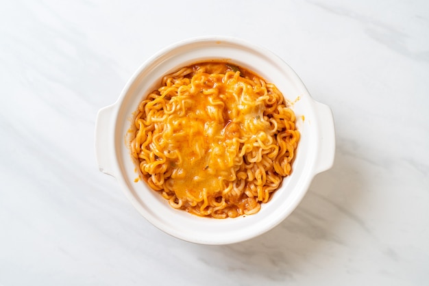 spicy instant noodle bowl with mozzarella cheese