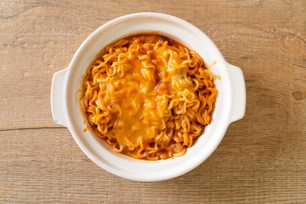 spicy instant noodle bowl with mozzarella cheese