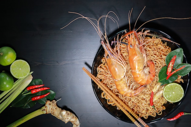 Spicy instant noodles soup with rivers shrimp on top, Tom Yum Kung name in Thailand Foods Style.