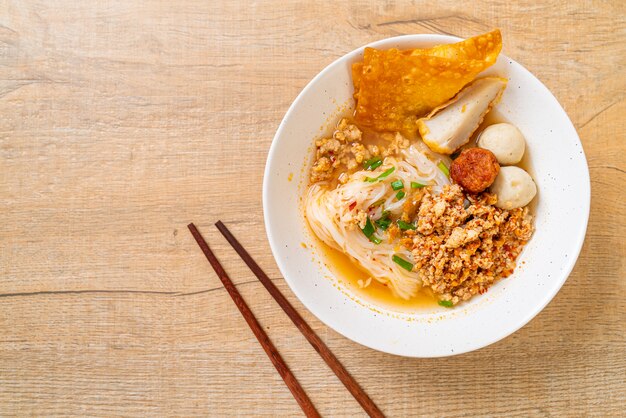 spicy noodles with fish ball and minced pork (Tom Yum Noodles)