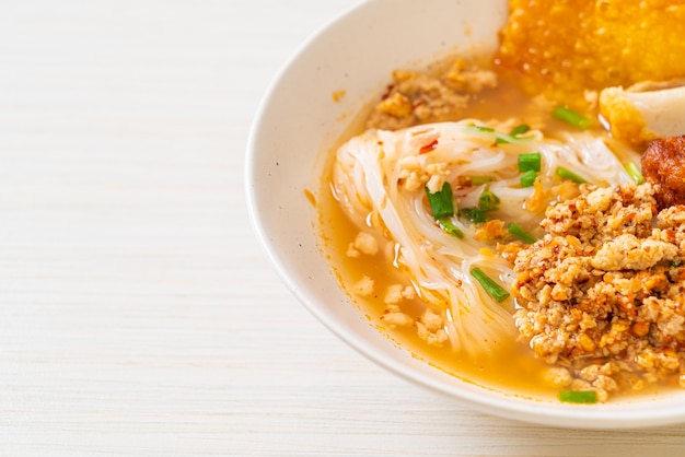 spicy noodles with fish ball and minced pork (Tom Yum Noodles)