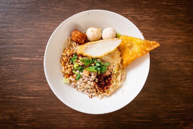 spicy noodles with fish ball and minced pork (Tom Yum Noodles)