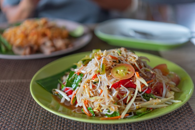 Spicy papaya salad with rice vermicelli