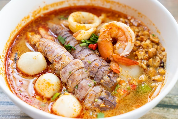 Spicy seafood noodles bowl in Thai style