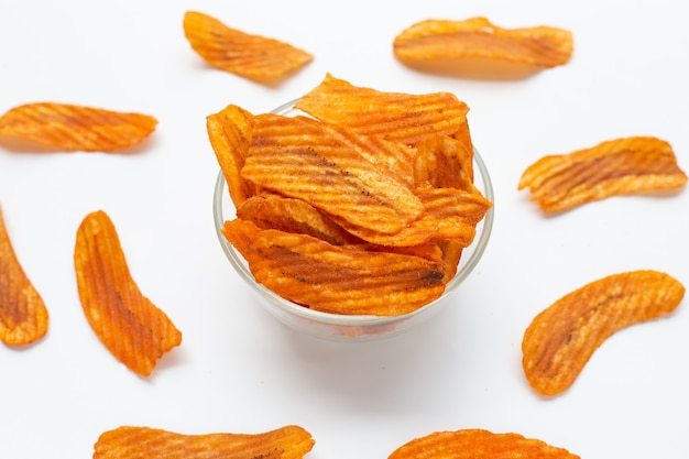 Spicy snack, Banana slice chips paprika flavor on white background.