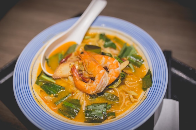 Spicy soup and seafood Udon Japanese noodles in japanese restaurant