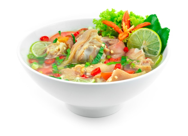 Spicy Soup with Pork Legs hot and Sour Good tasty Thai Food Style decoration carved Chili and vegetables sideview