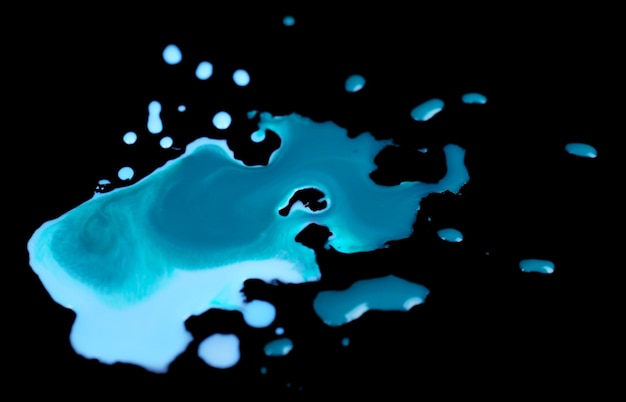 Spilled paint isolated on black