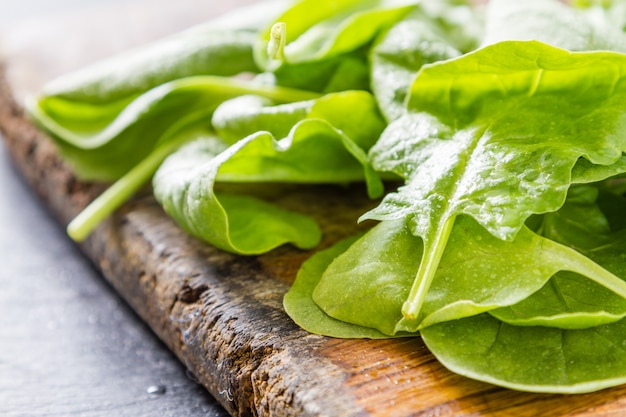 Spinach on dark stone background