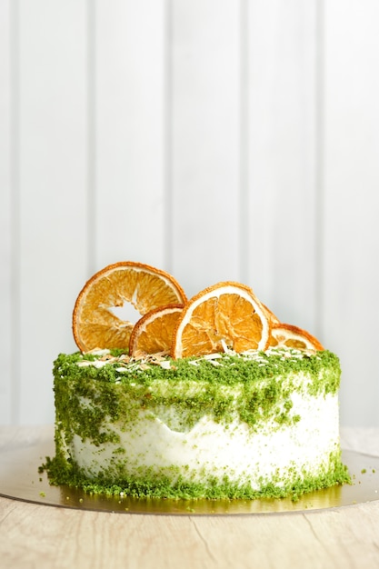 Spinach homemade cake on table. Wooden background.