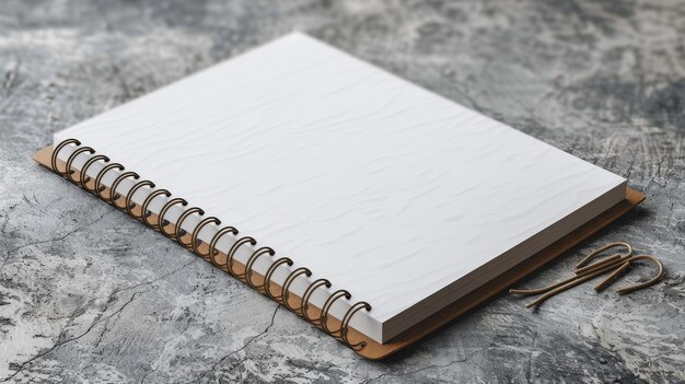 a spiral notebook with a spiral bound notebook on a marble surface