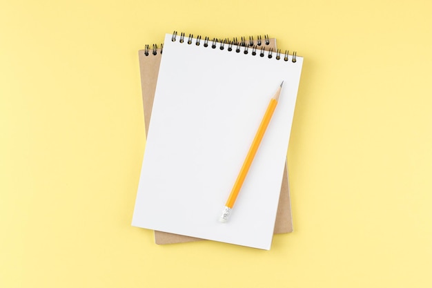 Spiral notepad on yellow background