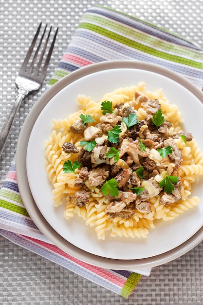 Spiral pasta with morel mushrooms