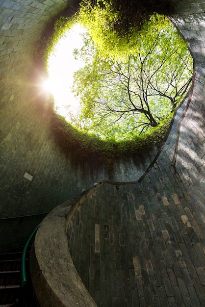 Spiral staircase of underground crossing in tunnel at Fort Canning Park, Singapore