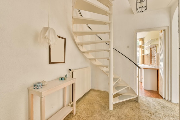 Spiral white staircase leading up to the residential cottage