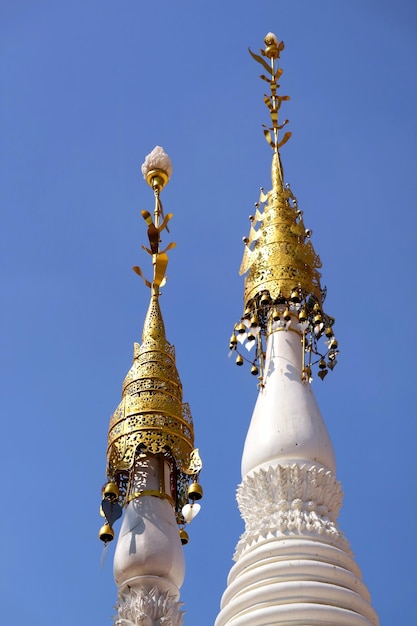 Spires of Mon Style Pagoda at Wat Chomphuwek Buddhist Temple in Nonthaburi Province Thailand