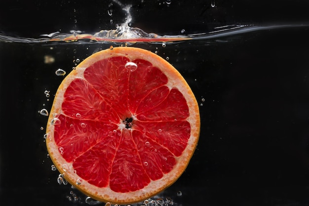 Splash of water with fruits lemon orange