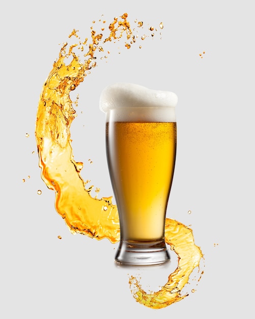 Splashing wave and big glass of fresh light beer on a light gray background with copy space. Octoberfest concept.