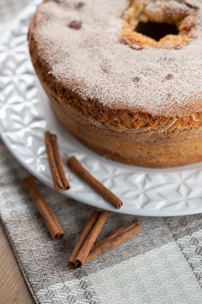 Sponge cake or chiffon cake with apples so soft and delicious sliced with ingredients cinnamon eggs flour apples on wooden table Home bakery concept for background and wallpaper