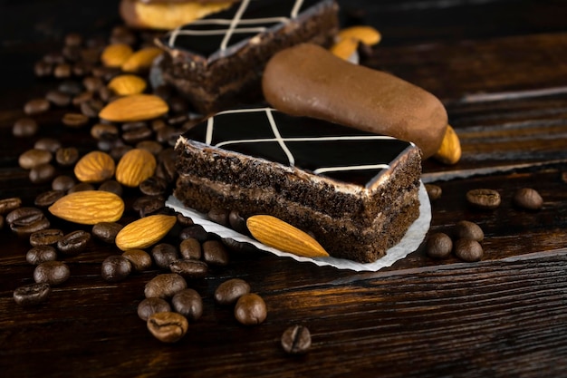 Sponge chocolate cake with a scattering of coffee beans and almonds