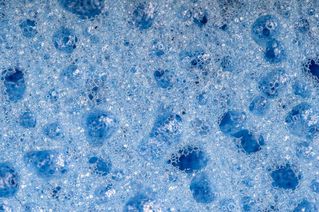 Photo sponge detail texture, sponge texture close up background. cellulose blue sponge texture