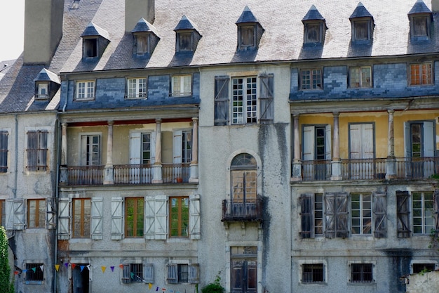 Spooky wooden facade of abandoned house in Arreau village France