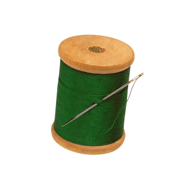 Spool of thread and needle isolated